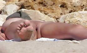 Amateur naked milf filmed at the beach